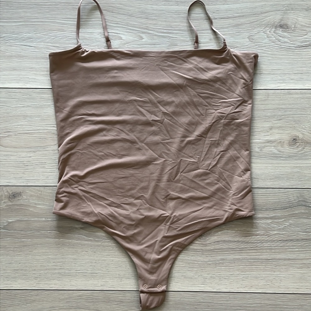 DELTA BOGART LINGERIE LTD. Thong Bodysuit - tan